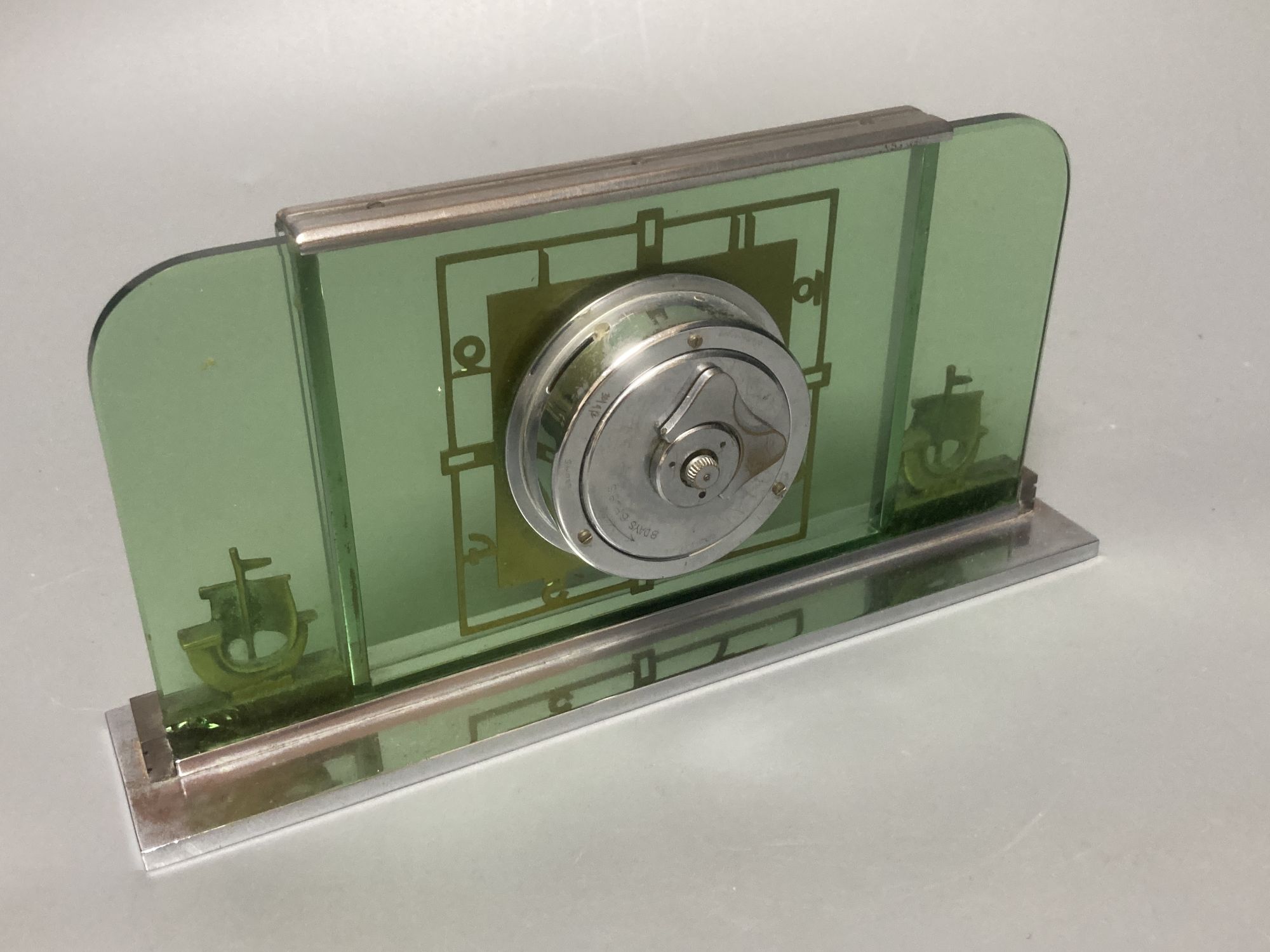 An Art Deco chrome and glass mantel timepiece, width 22cm